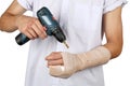 Close up of young Asian boy with arm plaster fiberglass cast covering the wrist finger and arm. Royalty Free Stock Photo