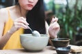 Close up of young Asian woman is eating Royalty Free Stock Photo