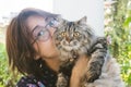 Close up of young Asian woman playing with her persian cat Royalty Free Stock Photo