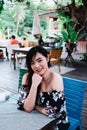 Close up of young Asian woman in the restaurant. Royalty Free Stock Photo