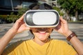 Close up of young Asian woman wearing virtual reality goggles and exciting the VR simulation experience. Royalty Free Stock Photo