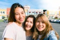 Close up of young Asian women group selfie themselves in the pastel buildings city in nice sky morning.