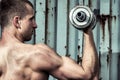 Close up young athletic man doing workout with heavy dumbbell Royalty Free Stock Photo