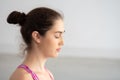 Close up of Young attractive Caucasian woman closed eyes doing meditating with mindfulness.