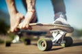 Close up of young attractive man riding longboard in the park. Royalty Free Stock Photo