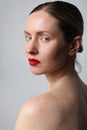 Vertical portrait of young attractive woman with perfect skin and red lips. Royalty Free Stock Photo