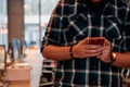 Close Up Young Bearded Programmer Using Smartphone in Office