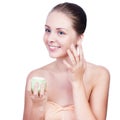 Close-up young beautiful face of girl applying moisturize cream Royalty Free Stock Photo