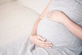 Close up young beautiful pregnant woman hand touching her belly Royalty Free Stock Photo