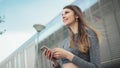 Close-up Of A Young Beautiful Sports Fitness Girl Holding A Smartphone In The Hands, Using A Fitness App. Modern City Royalty Free Stock Photo