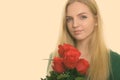 Close up of young beautiful teenage girl holding red roses ready for Valentine's day Royalty Free Stock Photo