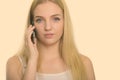 Close up of young beautiful teenage girl talking on mobile phone Royalty Free Stock Photo