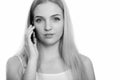 Close up of young beautiful teenage girl talking on mobile phone Royalty Free Stock Photo