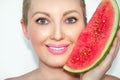 Close-up of a young beautiful woman with a water-melon. The concept of healthy and moisturized skin. Royalty Free Stock Photo