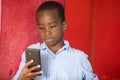 Close-up of a young boy with mobile phone Royalty Free Stock Photo
