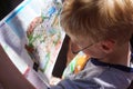 Young Boy Reading Map Royalty Free Stock Photo