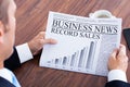 Close-up Of Young Businessman Reading News Royalty Free Stock Photo