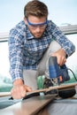 Close up young carpenter at work Royalty Free Stock Photo