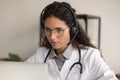 Female doctor in headset talk on video call with patient Royalty Free Stock Photo