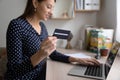 Young woman use laptop paying with credit card online Royalty Free Stock Photo