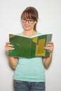 Close-up of young caucasian woman writing on a paper Royalty Free Stock Photo