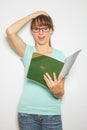 Close-up of young caucasian woman writing on a paper Royalty Free Stock Photo