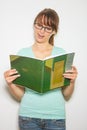 Close-up of young caucasian woman writing on a paper Royalty Free Stock Photo