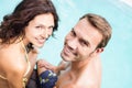 Close-up of young couple sitting by poolside Royalty Free Stock Photo