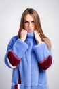 Dark-haired woman in a blue fur coat Royalty Free Stock Photo