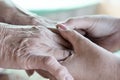 Close-up of a daughter holding her mother`s hand on Mother`s Day Royalty Free Stock Photo