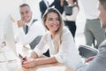 Close up. young employees sitting at the office Desk Royalty Free Stock Photo