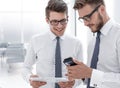 Close up.young employees use gadgets in their office Royalty Free Stock Photo