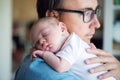 Close up of young father holding his newborn baby son Royalty Free Stock Photo