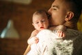 Young father holding his newborn baby son Royalty Free Stock Photo