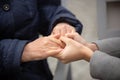 Close-up of young female hands holding senior woman hands Royalty Free Stock Photo