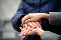 Close-up of young female hands holding senior woman hands Royalty Free Stock Photo