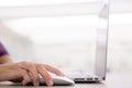 Close up of young female hands using mouse remote for laptop in modern office Royalty Free Stock Photo