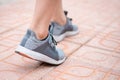 Close up of young fitness woman wearing running shoes on running track Royalty Free Stock Photo