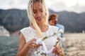 Close-up of a young girl having a good time on the seaside. Holiday, sea