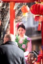 Close-up of a young girl on the main float representing the Chinese New Year symbol, the Water Rabbit, in the Usera neighborhood,