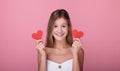 Close-up of a young girl with paper red hearts Royalty Free Stock Photo