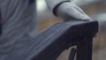 Close-up of young girl`s hand sliding over railing. Hand in grey glove touches railing outdoors in cold weather Royalty Free Stock Photo