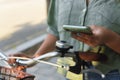 Close-up of a young girl using her smartphone on a bicycle Royalty Free Stock Photo