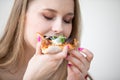 Portrait of a girl eating a slice of pizza. Royalty Free Stock Photo