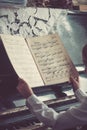 Close up of young girls hands, holding notes.