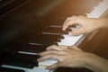 Close up of young girls hands, playing piano. vintage tone filte Royalty Free Stock Photo