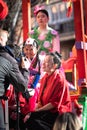 Close-up of young girls on the main float being interviewed, representing the symbol of the Chinese New Year, the Water Rabbit, in