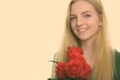 Close up of young happy teenage girl smiling while holding red roses ready for Valentine's day Royalty Free Stock Photo