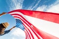 Happy woman holding United States of America flag Royalty Free Stock Photo