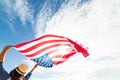 Close up young happy woman holding United States of America flag Royalty Free Stock Photo